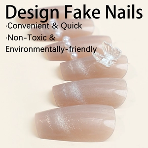 Cat eye press-on nails in soft pink with 3D butterflies and elegant pearl accents
