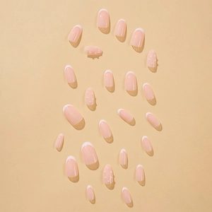 Elegant nude pink press-on nails with white French tips and delicate pearl accents
