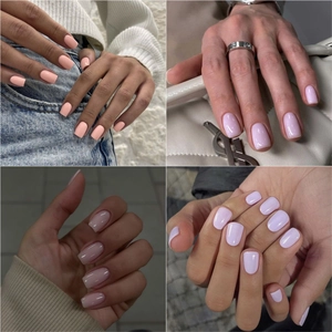 Detailed close-up of handmade solid color press-on nails in pink and purple shades