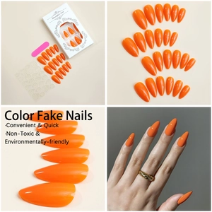 Detailed set of orange almond press-on nails with tools and application display