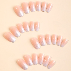 Glittery nude pink gradient coffin press-on nails with silver shimmer finish