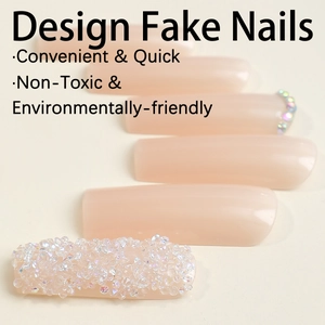 Extra long nude pink press-on nails with sparkling rhinestones and square tip design