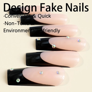 Long square French press-on nails with black tip and rhinestone accents on cream background