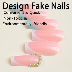 Pink French tip press-on nails with rhinestone accents and gold beads in long coffin shape