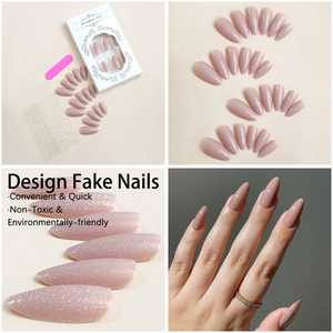 Macro detail of nude pink almond press-on nails with fine glitter and application kit