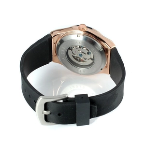 Close-up of skeleton automatic watch with rose gold case and transparent exhibition back