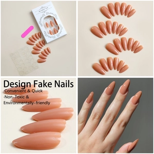 Detail of almond-shaped pink press-on nails with file, adhesive tabs and packaging