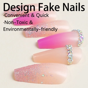 Pink gradient glitter press-on nails with iridescent diamonds in long coffin shape