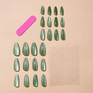 Forest green cat eye almond press-on nails set with adhesive tabs and file tool