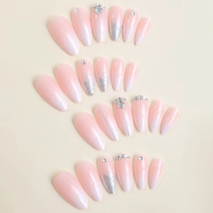 Elegant ombre pink almond press-on nails with luxury rhinestones and silver glitter