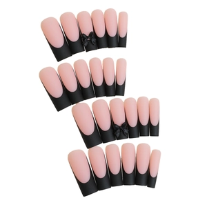 Pink matte coffin press-on nails with black French tips and 3D bow accents
