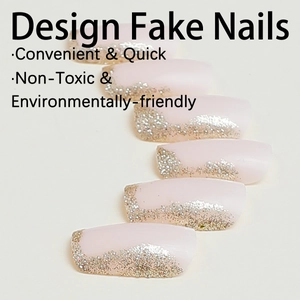 Pink matte press-on nails with luxury gold glitter French tips in a rectangular shape