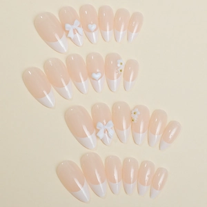 French tip almond press-on nails with 3D white bows, flowers and heart accents