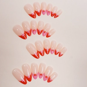 Press-on nails set with red and pink French heart designs in varied shapes and sizes