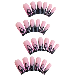 Long coffin fake nails featuring pink base with black flame and grid patterns