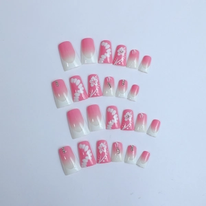 Faux ongles dégradés rose et blanc avec motifs floraux et strass, coffret de 24