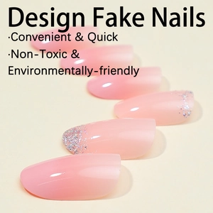 Pink gradient press-on nails with silver glitter tips in a natural oval shape