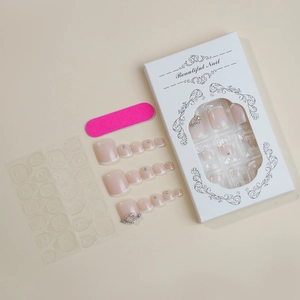 French style toenail press-on set with pink base, white tips, rhinestones and heart gems