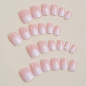 Set of 24 pink ombre press-on nails in short square shape with a glossy finish