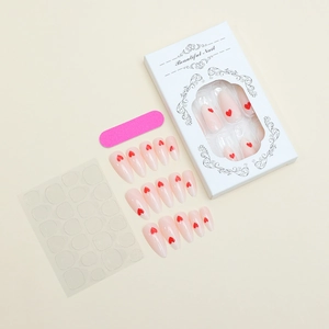 Kit of almond press-on nails with red heart patterns, includes file and adhesive tabs