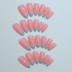 Almond shaped press-on nails with pink translucent base and silver glitter French tips