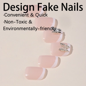 Classic French nude pink press-on toenails with white tips and silver butterfly accents