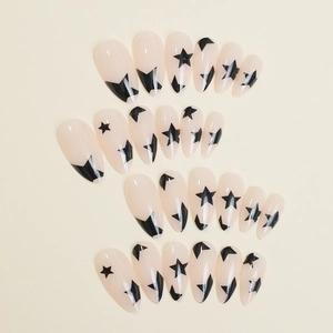 Almond-shaped nude press-on nails with minimalist black star patterns on white background
