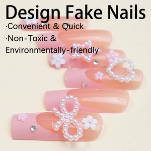 Faux ongles French rose Barbie avec perles 3D, nœuds et étoiles décoratives