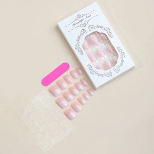Pink ombre press-on nail kit with file, adhesive tabs and elegant white display box