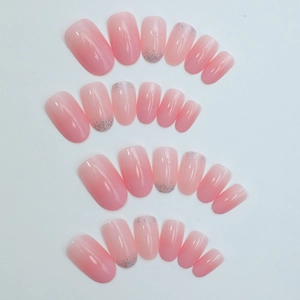 Pink gradient press-on nails with silver glitter accent and glossy resin finish