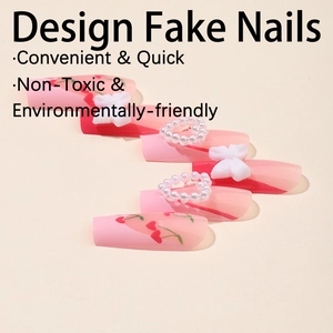 Pink coffin fake nails with cherry patterns, 3D bows, and pearl heart decorations