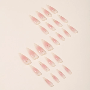 Rosa Ombre Stiletto Kunstnägel mit goldenen Sternenmustern und glänzendem Finish-Set