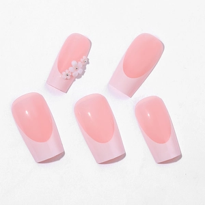 Long coffin pink gradient press-on nails with 3D white floral design and silver beads