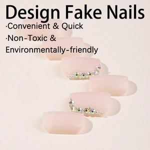 Short square nude pink press-on toenails with rhinestone accents and silver beads