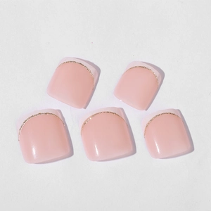 French tip glitter toe nail press-ons in nude pink with shiny gold sparkle edges