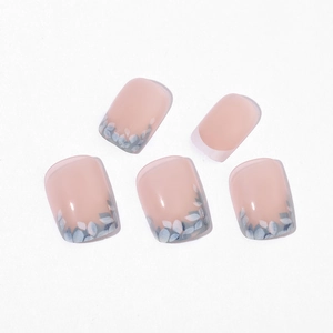 Short square press-on nails with pink base and blue floral leaf patterns, glossy finish