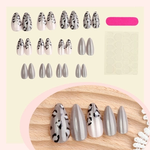 Cat eye press-on nails with leopard print and almond shape, full kit including glue