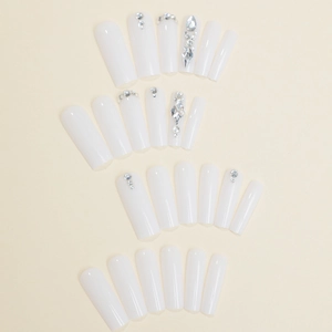 White glossy press-on nails with rhinestone accents in a 24-piece full set