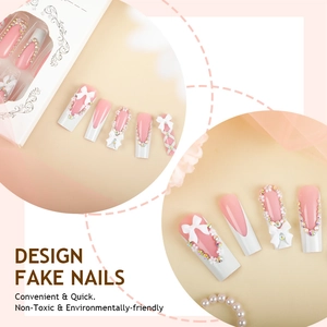 Pink and white French press-on nails with 3D bows and rhinestones in display box