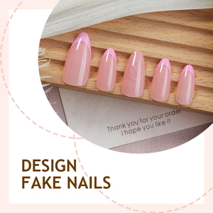 Pink French almond press-on nails with glossy finish on a striped wooden display board