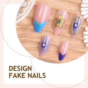 Almond-shaped sapphire blue and nude press-on nails with 3D gold flowers and evil eye design