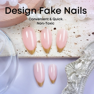Elegant almond-shaped nude pink press-on nails with golden French tips and pearl accents