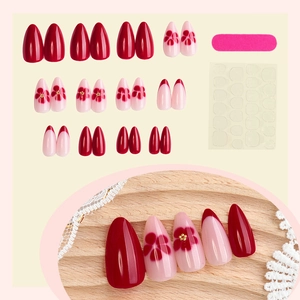French wine red press-on nail set with golden floral designs and manicure tool kit