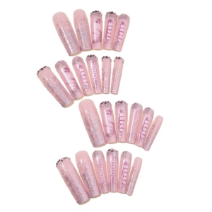 Long pink press-on nails with silver glitter rhinestones and 100 dollar bill pattern