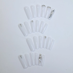 Extra long milky white coffin press-on nails with silver rhinestones and 3D gems