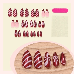Christmas almond press-on nails set with red stripes and white candy patterns