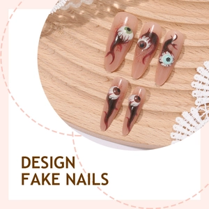 Long stiletto Halloween fake nails featuring 3D realistic eyeball and red bloodshot designs