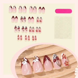 Handmade almond press-on nails set with leopard print, cherry, and daisy floral patterns
