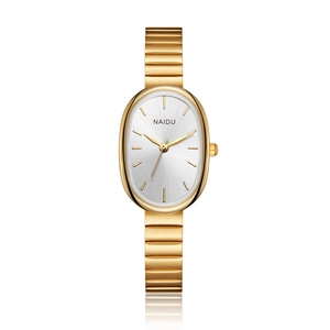 Elegant women's quartz watch with oval gold case and matching chain link bracelet
