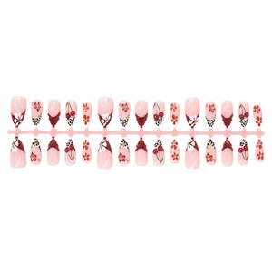 Almond press-on nails with leopard print, 3D floral designs and cherry patterns